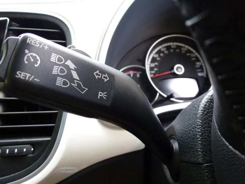 Free Stock Photo: Close up on a car indicator stalk on the steering column showing the controls for the headlights and indicators
