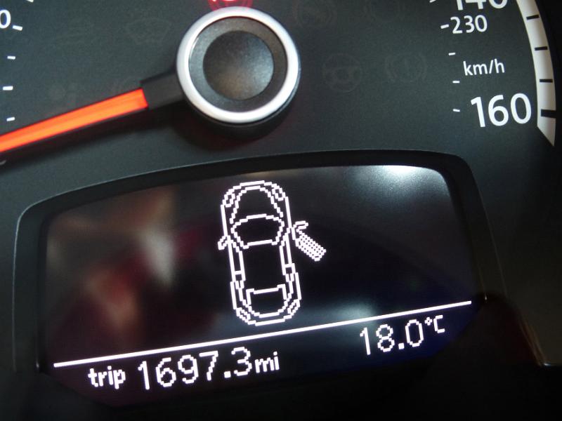 Free Stock Photo: Illuminated information display on a car dashboard showing an open door, the distance travelled and interior temperature