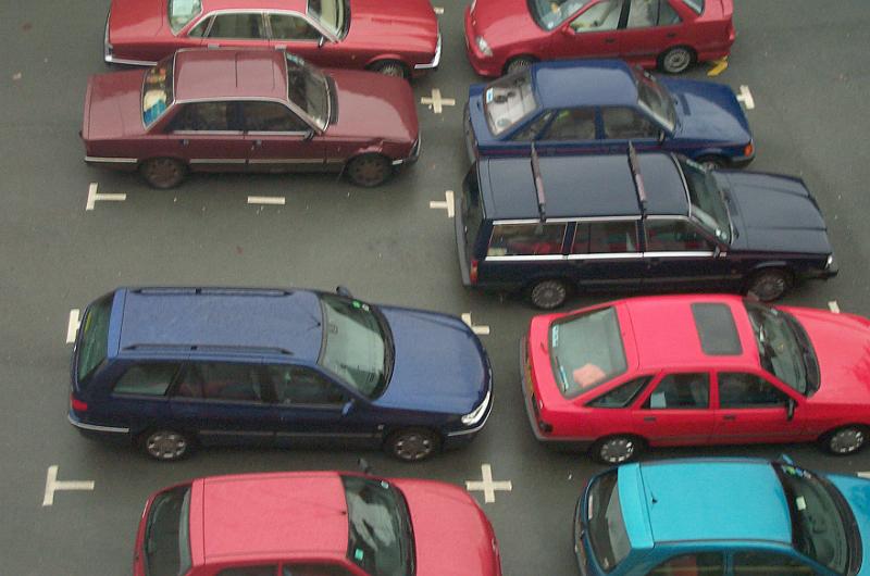 Free Stock Photo: Assorted makes and colors of cars parked in a parking lot in a high angle view