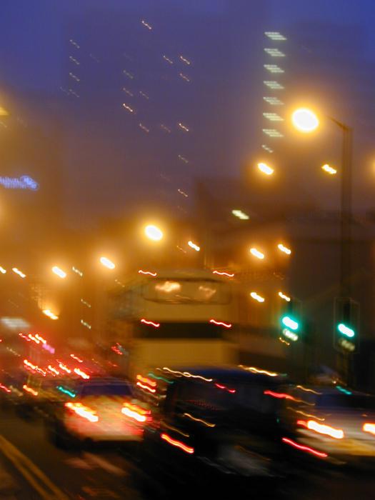 Free Stock Photo: Busy street with bright ghts in evening in motion blur.