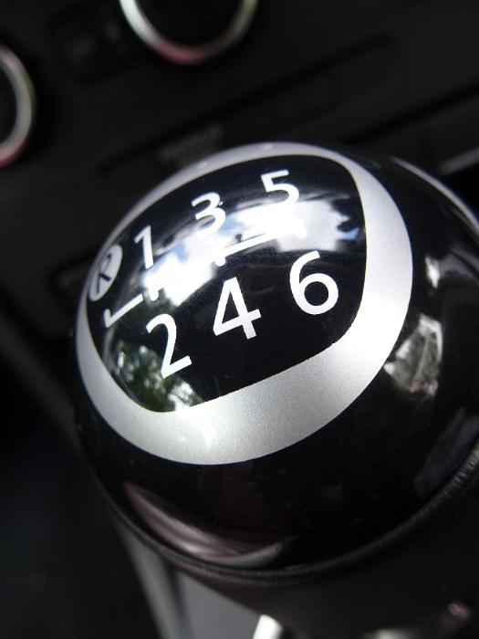 Free Stock Photo: Close up detail of the gear shift knob on a manual car showing six gear selections