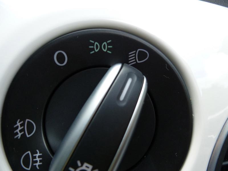 Free Stock Photo: Headlight switch on a white car dashboard positioned to full beam in a travel and transport concept