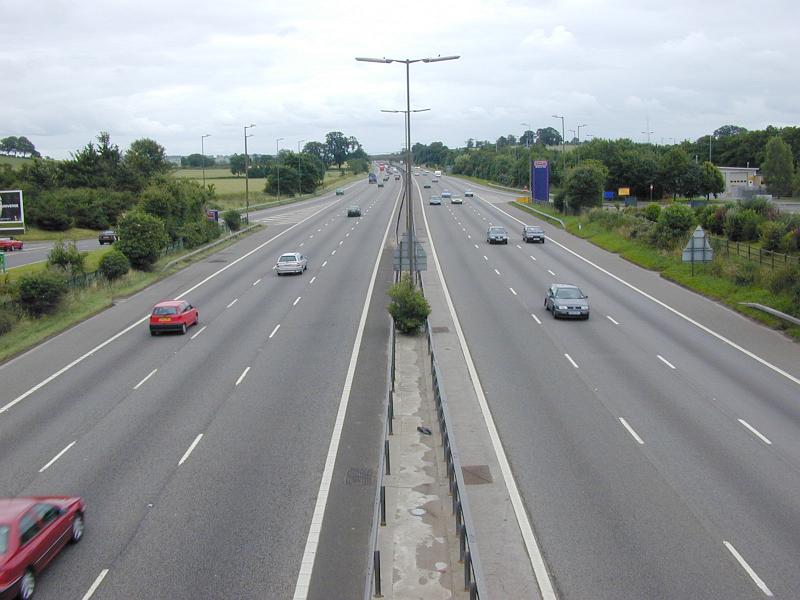 Free Stock Photo: Aerial view of not busy highway with few cars in rural area in daylight.