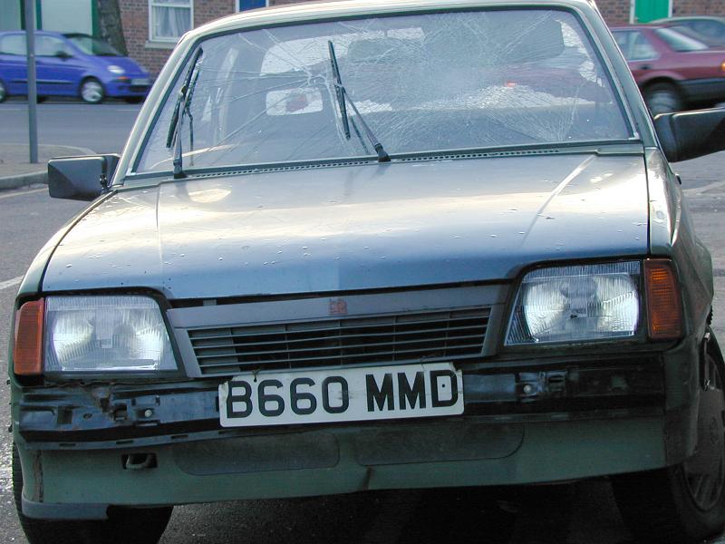 Free Stock Photo: Front view of old car bumper with cracked windshield.