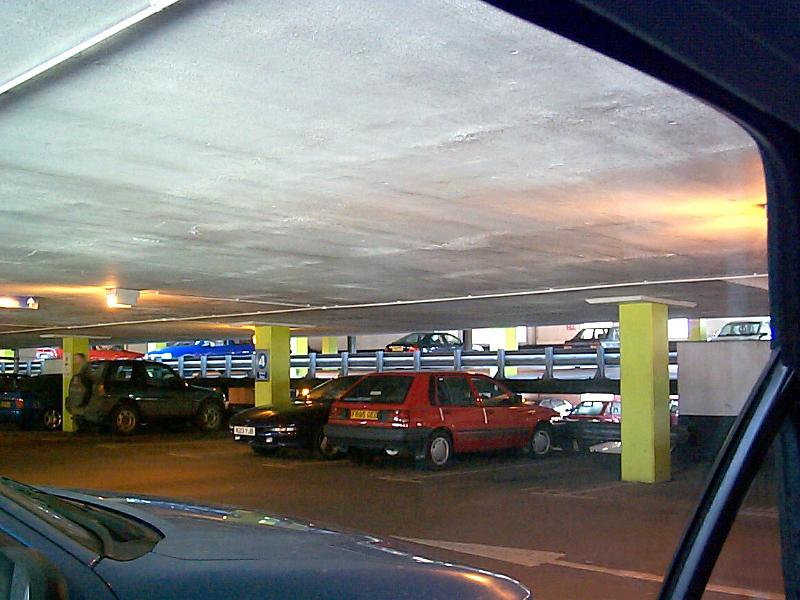 Free Stock Photo: Multistoried car park photographed from car window.