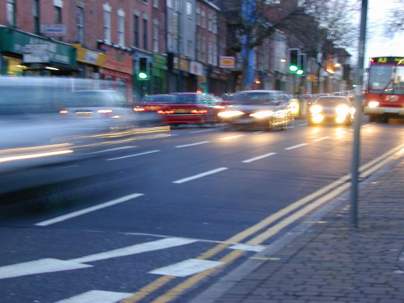Free Stock Photo: Moving stream of vehicles on busy street in the evening.