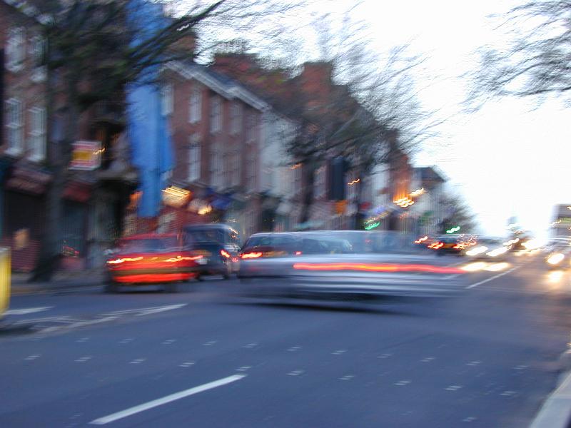 Free Stock Photo: Transport concept of an urban road at twilight with motion blur cars and traffic in a commercial district and foreground copy space