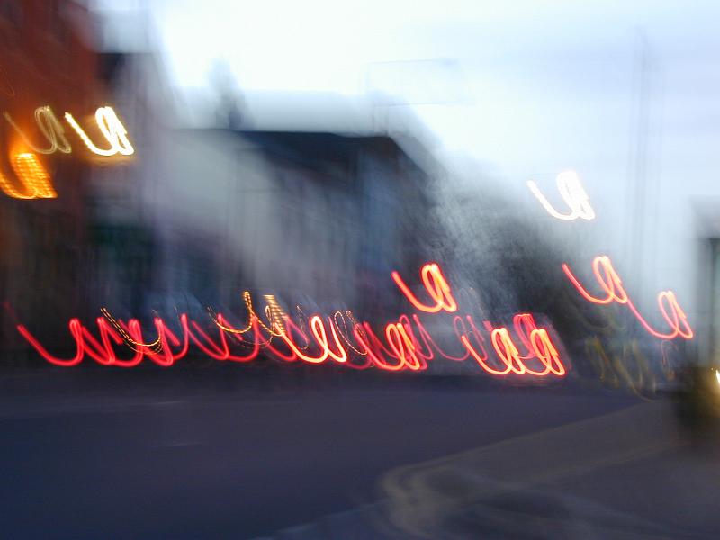 Free Stock Photo: Creative blurry image of car lights bouncing and forming loops down city street