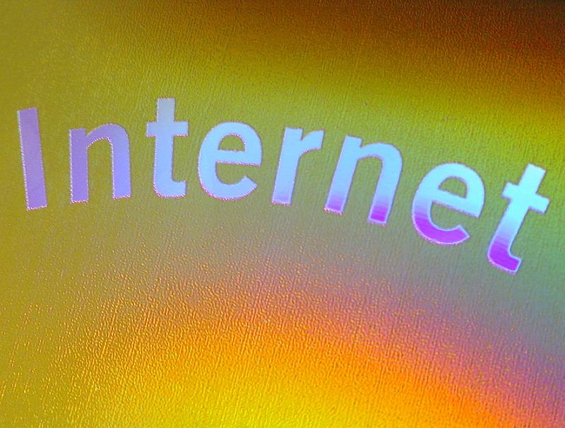 Free Stock Photo: gold background with irridescent silver purple letters spelling internet