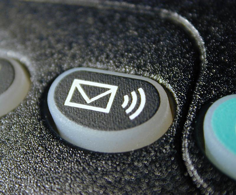 Free Stock Photo: Voice mail sound alert button with envelope icon on a keypad in a close up view