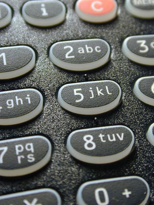 Free Stock Photo: Alphanumeric keypad on a telephone with black keys showing numbers and letters in a communications concept