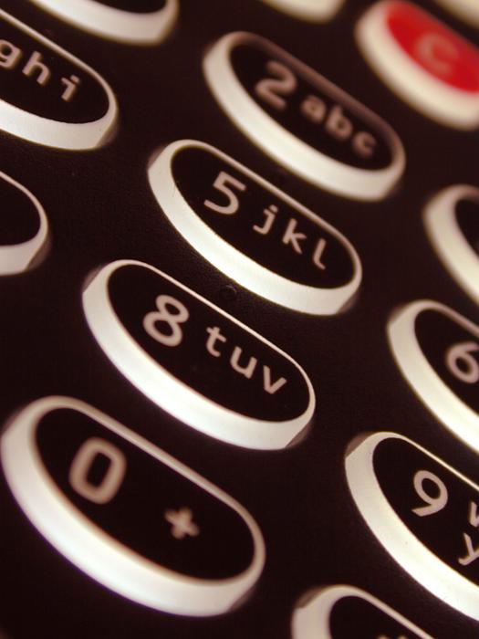 Free Stock Photo: Black alphanumeric keypad with buttons on a close up oblique angle view