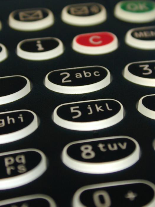 Free Stock Photo: Close up view of an alphanumeric keypad on a black mobile phone with buttons in a communication concept