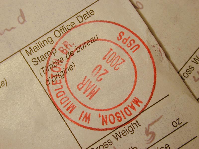 Free Stock Photo: Date stamp on a customs or dispatch form for the US postal service showing the city of origin
