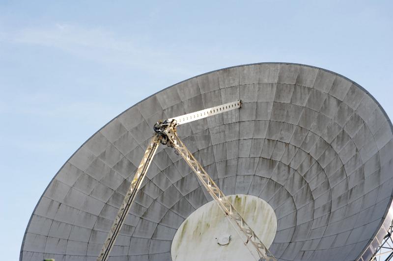 Free Stock Photo: Close up of a parabolic satellite antenna or ground station dish against a blue sky in a telecommunications concept