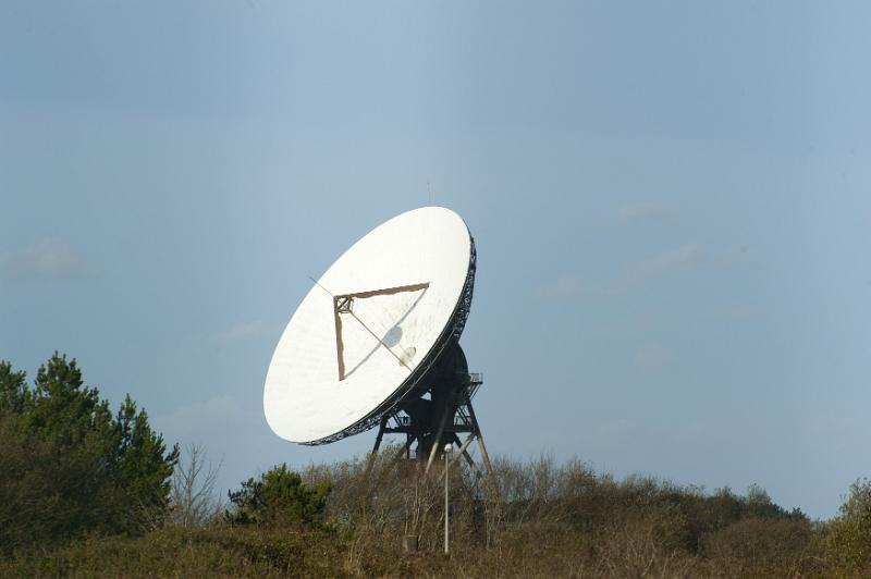 Free Stock Photo: Large parabolic telecommunications antennae or dish on a hilltop on the skyline in a communications concept