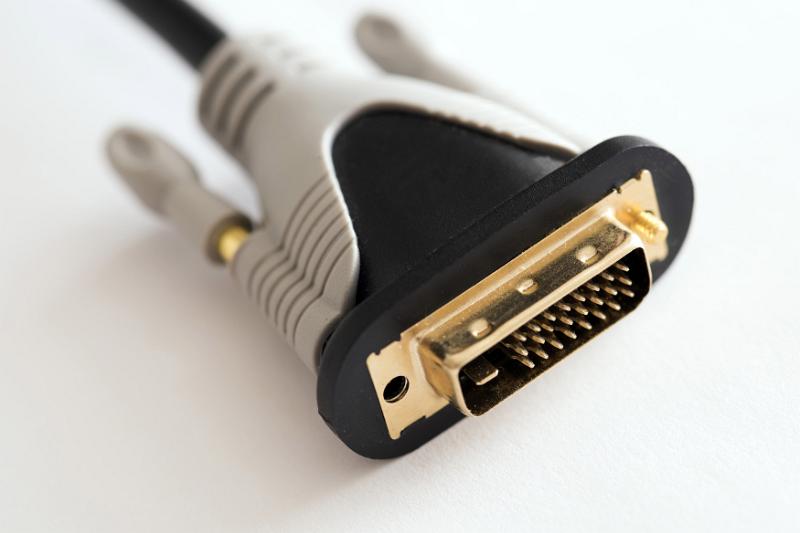 Free Stock Photo: Black, white and gold plated male end DVI connector close up over white background
