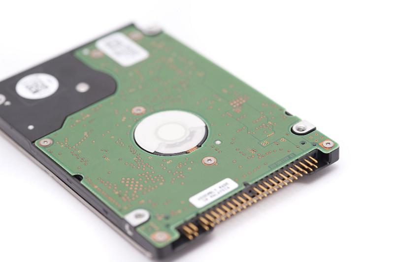 Free Stock Photo: Selective focus close up on single internal IDE hard drive over white background for technology concept