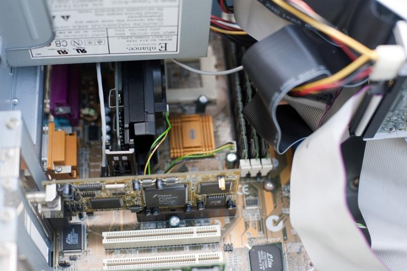 Free Stock Photo: Various types of ribbons, RAM chips and video card assembled inside an open computer case