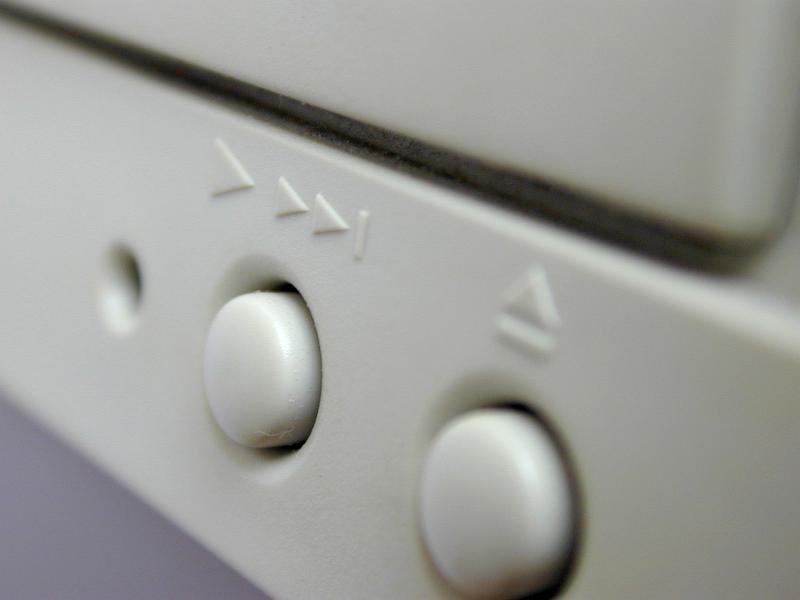 Free Stock Photo: Eject and fast forward buttons on white media equipment in a close up view conceptual of personal entertainment and technology