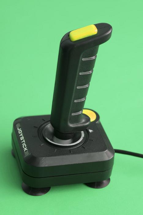 Free Stock Photo: Computer joystick with cable standing against green background