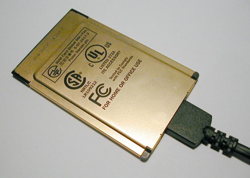 Free Stock Photo: Close up on brass colored internal PC modem with plug over neutral gray background