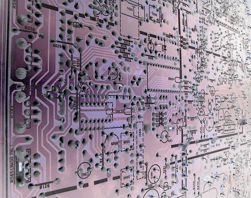 Free Stock Photo: Abstract close up of the circuitry within a large, complex purple electronic motherboard.