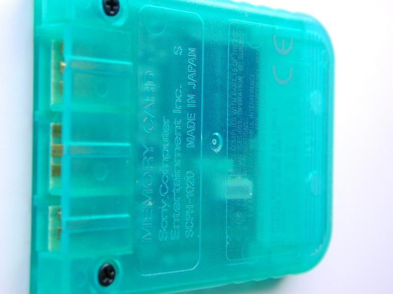 Free Stock Photo: Sony Play Station PS1 Memory card of blue transparent plastic, viewed from the back, close-up on white background