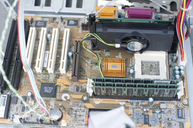 Free Stock Photo: First person view on open computer case showing accessory card slots, plugged in RAM chips, fan and assorted hardware - editorial use only