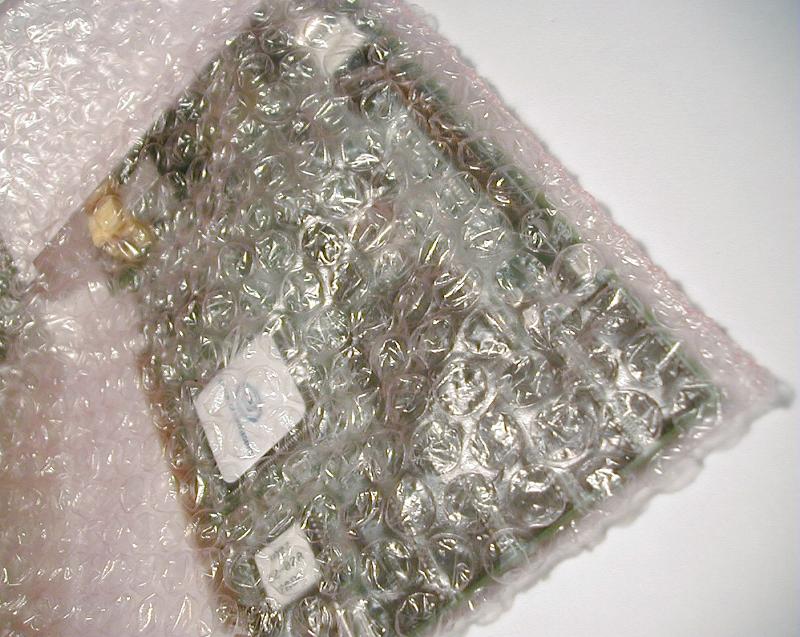 Free Stock Photo: A new computer expansion daughterboard in its bubble wrap packaging