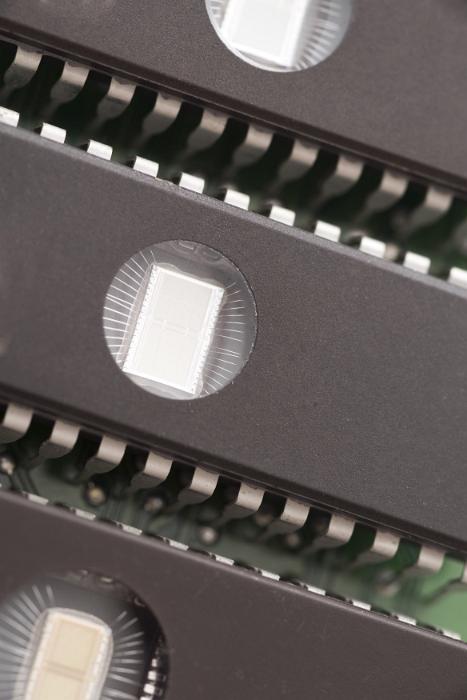 Free Stock Photo: Close up of three memory chips, lined up side by side as components on a computer motherboard.
