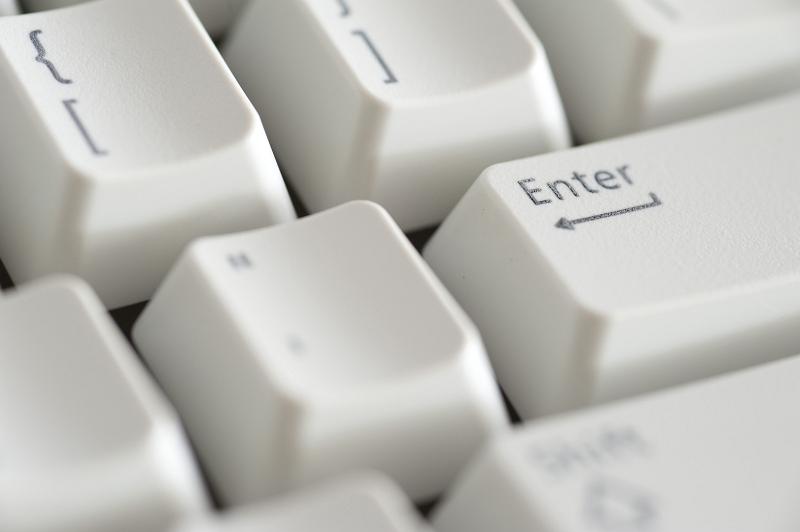 Free Stock Photo: a beige computer keyboard with the focus on the enter or return key