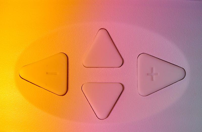 Free Stock Photo: Directional arrows on colorful orange and pink keypad