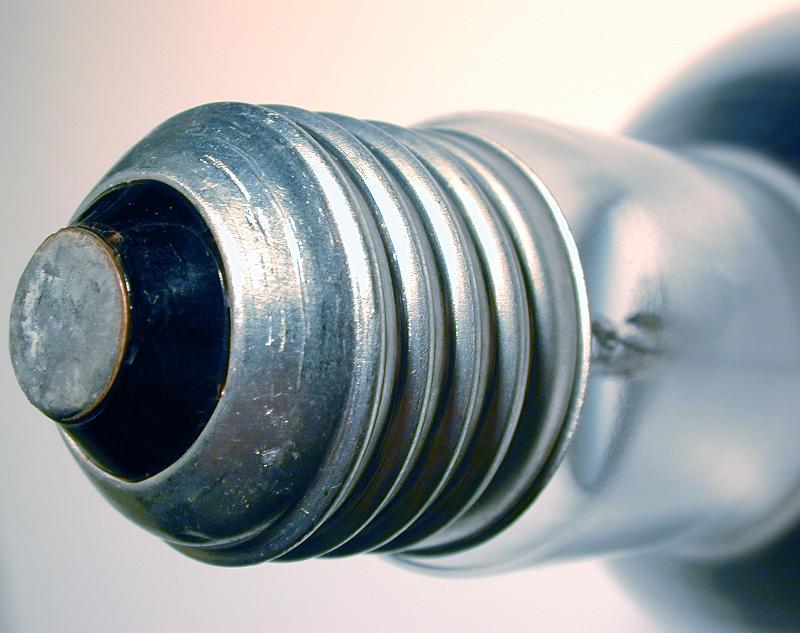 Free Stock Photo: Close up on an Edison screw mount on a globe or light bulb with focus to the threads in a power and energy concept