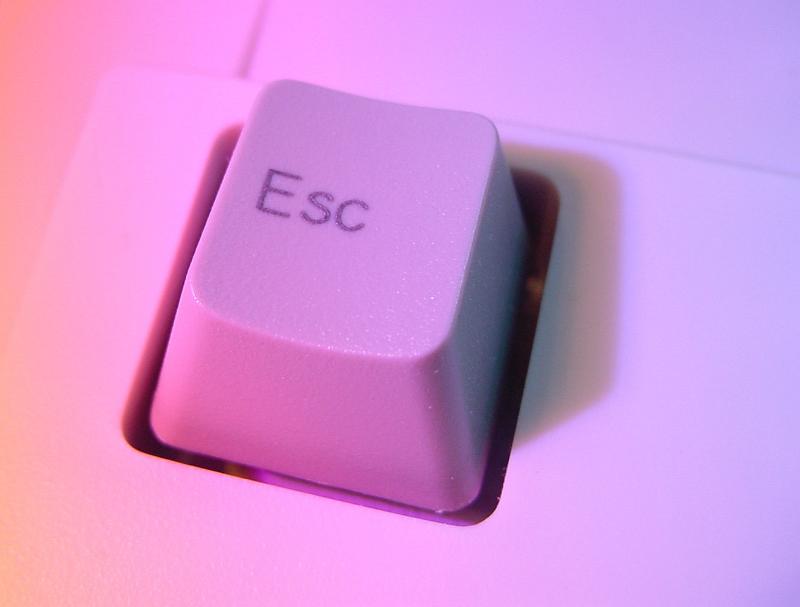 Free Stock Photo: an excape button an a computer keyboard illuminated in pink light