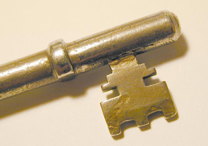Free Stock Photo: close up on an old mortice lock key focusing on the lock lever pins