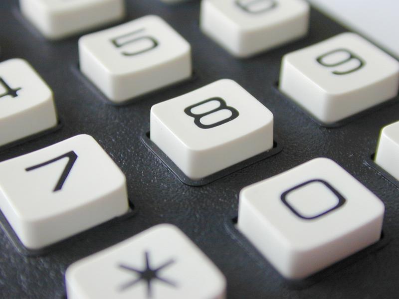 Free Stock Photo: Close up view on a telephone button keypad with focus to number 8 in the center in a close up oblique view in a communications concept