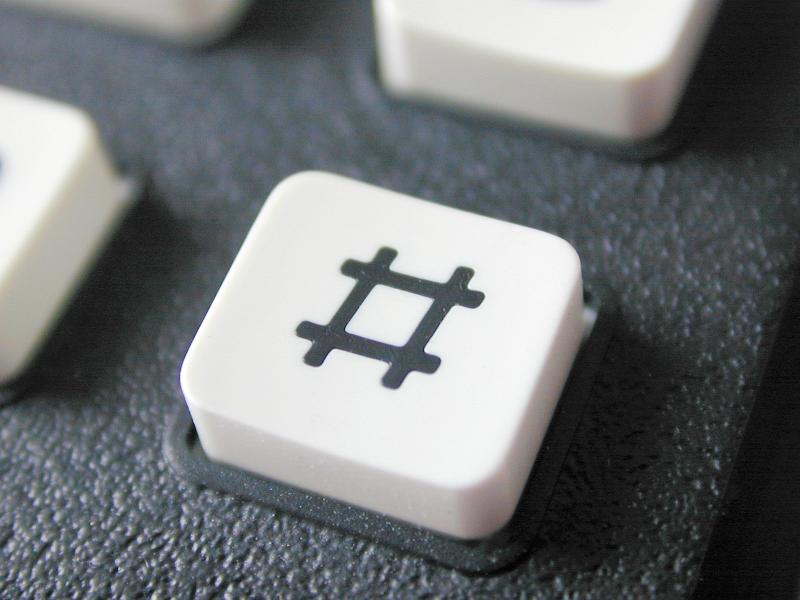 Free Stock Photo: Hash button on a mobile phone keypad with a number sign or pound sign icon, sometimes referred to as the hashtag