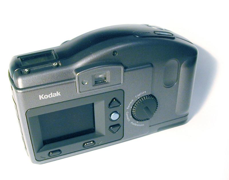 Free Stock Photo: Rear view of a Kodak digital compact camera showing the viewfinder and controls over white with copy space - editorial use only