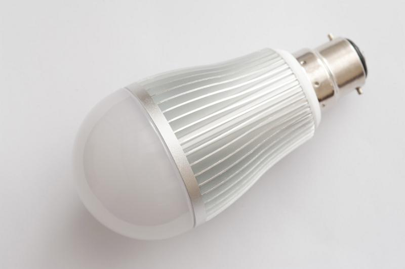 Free Stock Photo: LED electric light bulb with bayonet fitting lying on its side on white in a concept of eco-friendly efficient power and energy