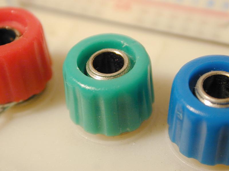 Free Stock Photo: electronic 4mm terminal posts or banana sockets with screw collet in red blue and green colour codings
