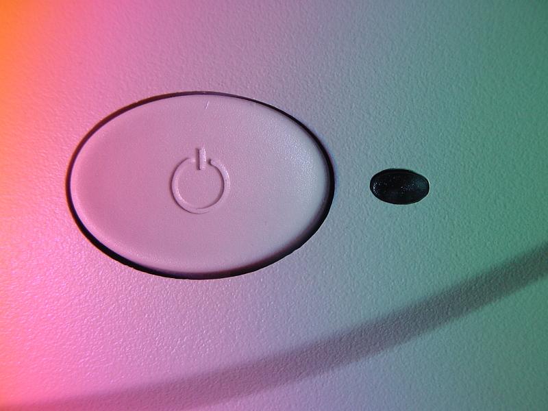 Free Stock Photo: White oval power button with standby or power symbol viewed in graduated pink through green light