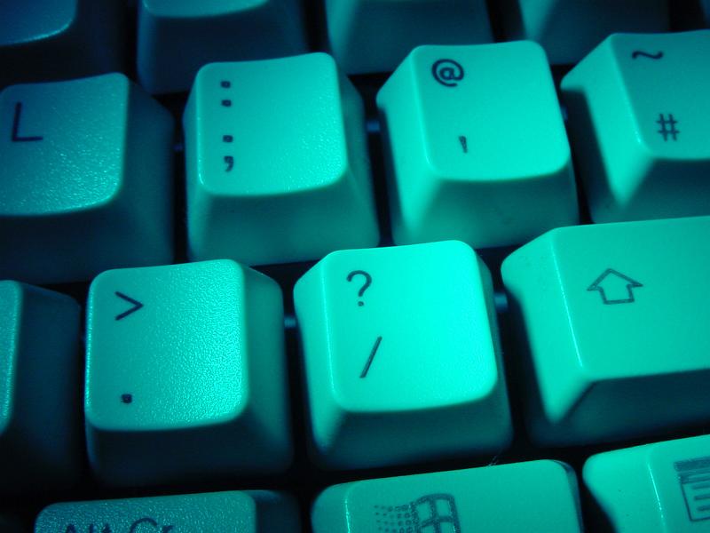 Free Stock Photo: A green lit question mark key on a computer keyboard