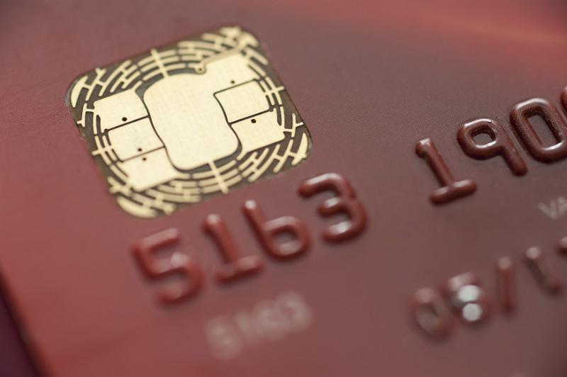 Free Stock Photo: macro image of a credit card smart chip with partial view of the card number