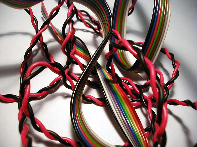 Free Stock Photo: Jumble of colorful plastic covered wires for electronic circuitry in a close up background view
