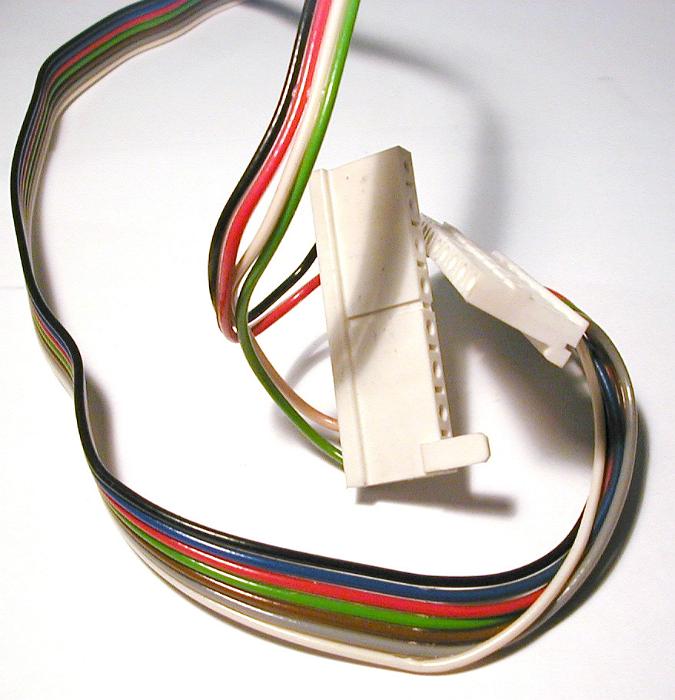 Free Stock Photo: Power cord with multicolored wires disconnected from white plug