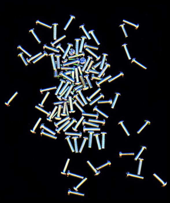 Free Stock Photo: Pile of small screws with spread over black background