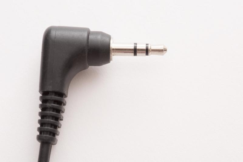 Free Stock Photo: Simple black plastic stereo jack audio plug close-up on white background