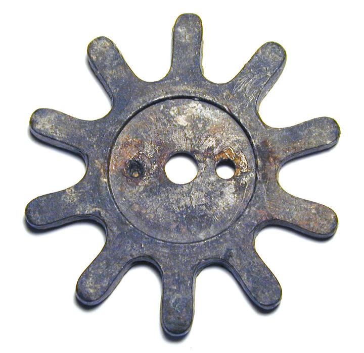Free Stock Photo: Small old vintage gearwheel, viewed in close-up and isolated on white background