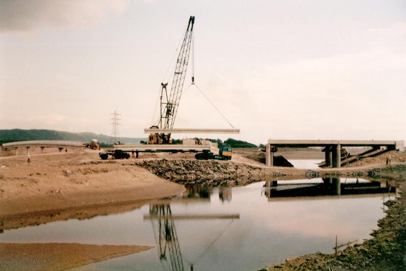 Free Stock Photo: Greenodd bypass under construction, with the crane reflecting in the river while building a bridge